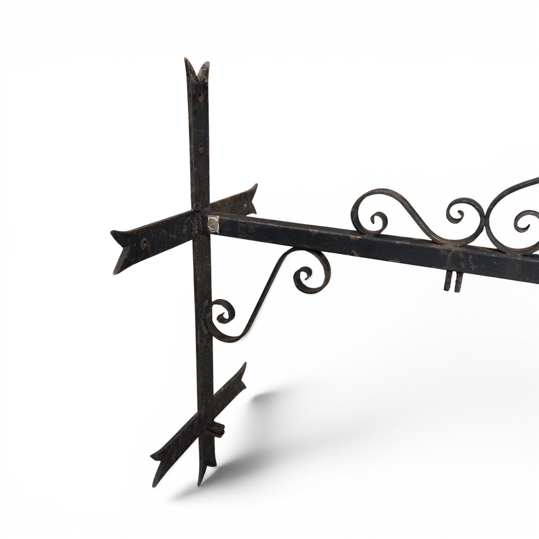 Antique wrought iron sign bracket, with strapwork scroll decoration and arrow form support, in weathered black painted finish