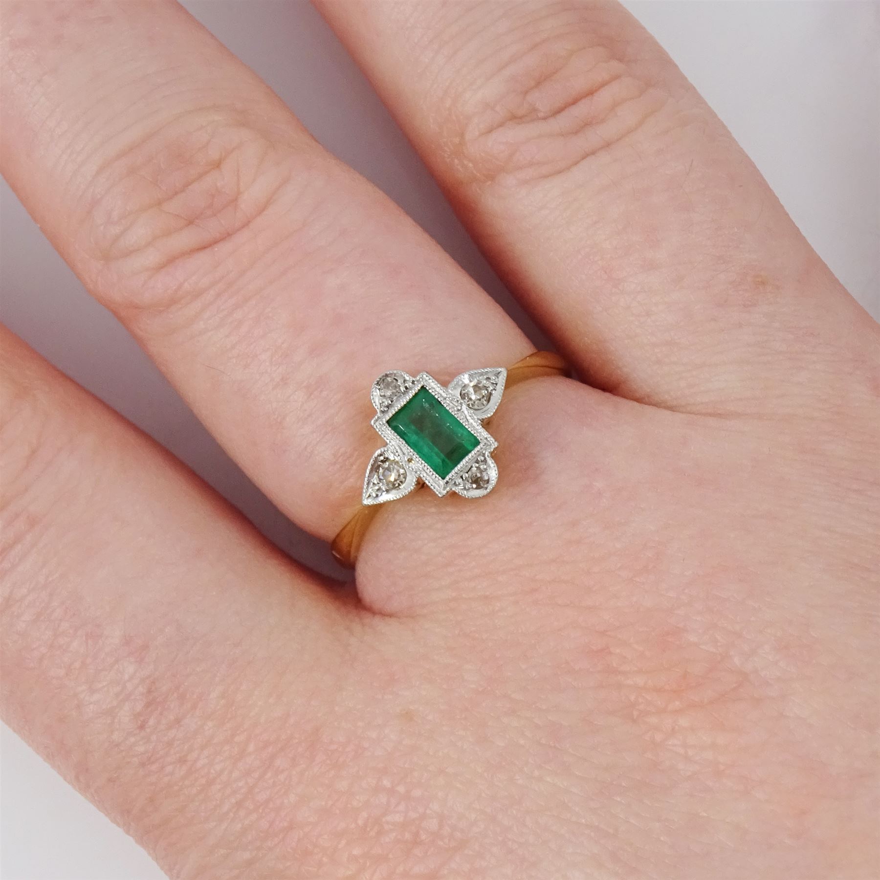 Edwardian gold and platinum emerald and diamond ring, single milgrain set rectangular cut emerald, surrounded by four single cut diamonds, stamped 18ct & PT
