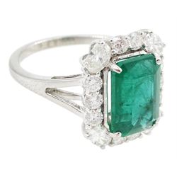 18ct white gold emerald and diamond cluster ring, single octagonal cut emerald of approx 2.90 carat, with oval cut diamonds set at each corner and round brilliant cut diamond surround, stamped, total diamond weight approx 0.90 carat