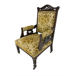 Edwardian mahogany framed gents salon armchair, shaped carved and pierced cresting rail, upholstered back seat and arms, turned supports
