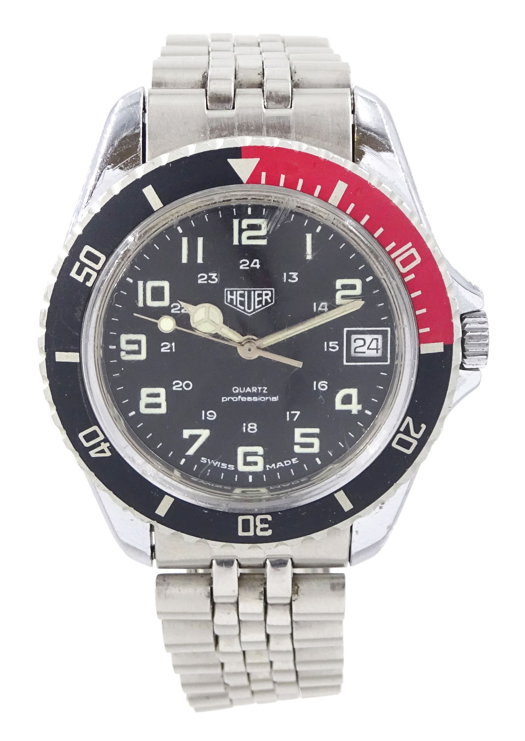 Heuer Professional gentleman's stainless steel quartz wristwatch, Ref. 980.043, black dial with luminous Arabic hour markers and date aperture, on stainless steel bracelet, with fold-over clasp