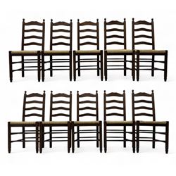 Set of ten 18th century design oak ladder back dining chairs, shaped cresting rail over four horizontal splats, rush seat raised on turned supports united by double stretchers
