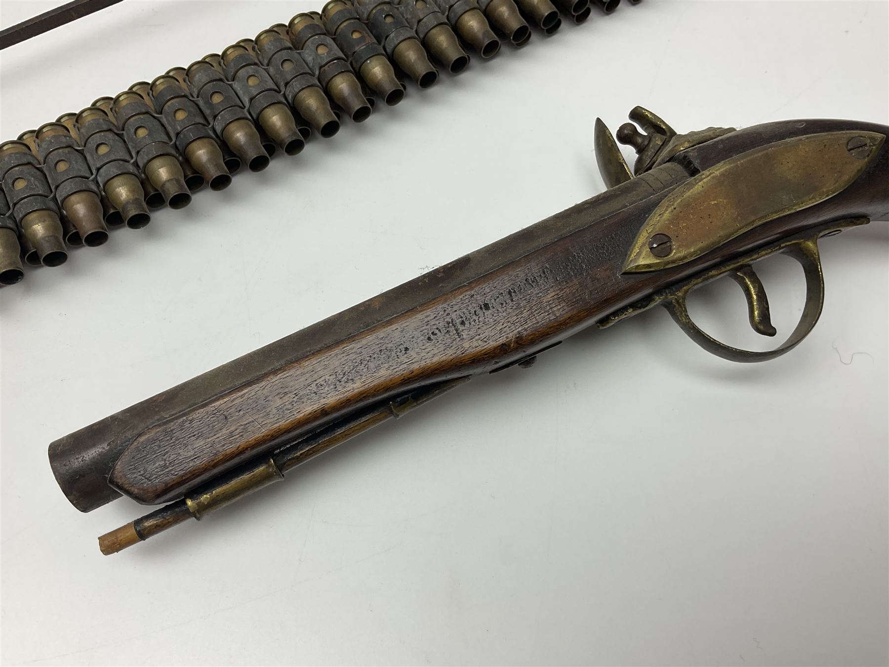 Leather covered swagger/sword stick with 40cm steel blade L62cm overall; another ash sword stick with 30cm diamond section steel blade; pair of fencing foils, the blades marked Solingen; two reproduction flintlock pistols; and 92cm inert cartridge belt (7)