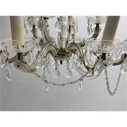 Victorian style glass eight branch chandelier, with drip trays, brass tone support, and drops