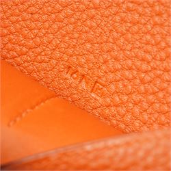Hermès - Dogon Duo wallet, orange Togo leather, with palladium-plated Clou de Selle fastening, detachable zipped coin purse and fitted interior, stamped 10N H, with original box