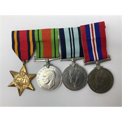 Four WWII medals comprising Burma Star, India 1939-45, and two defence medals 1939-1945 together with a Heuer stopwatch and three coins