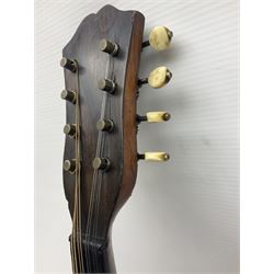 Late 19th century Italian lute back mandolin with segmented bowl back, bears label Gennaro Maglioni Napoli L61cm; in ebonised wooden case; together with another similar damaged Italian lute back mandolin for restoration or spares (2)