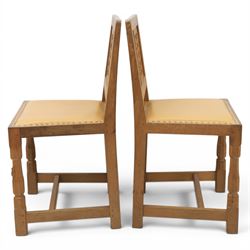 Mouseman - set of four oak lattice back chairs with tan seat with brass studded trim, with carved mouse signature, by the workshop of Robert Thompson of Kilburn