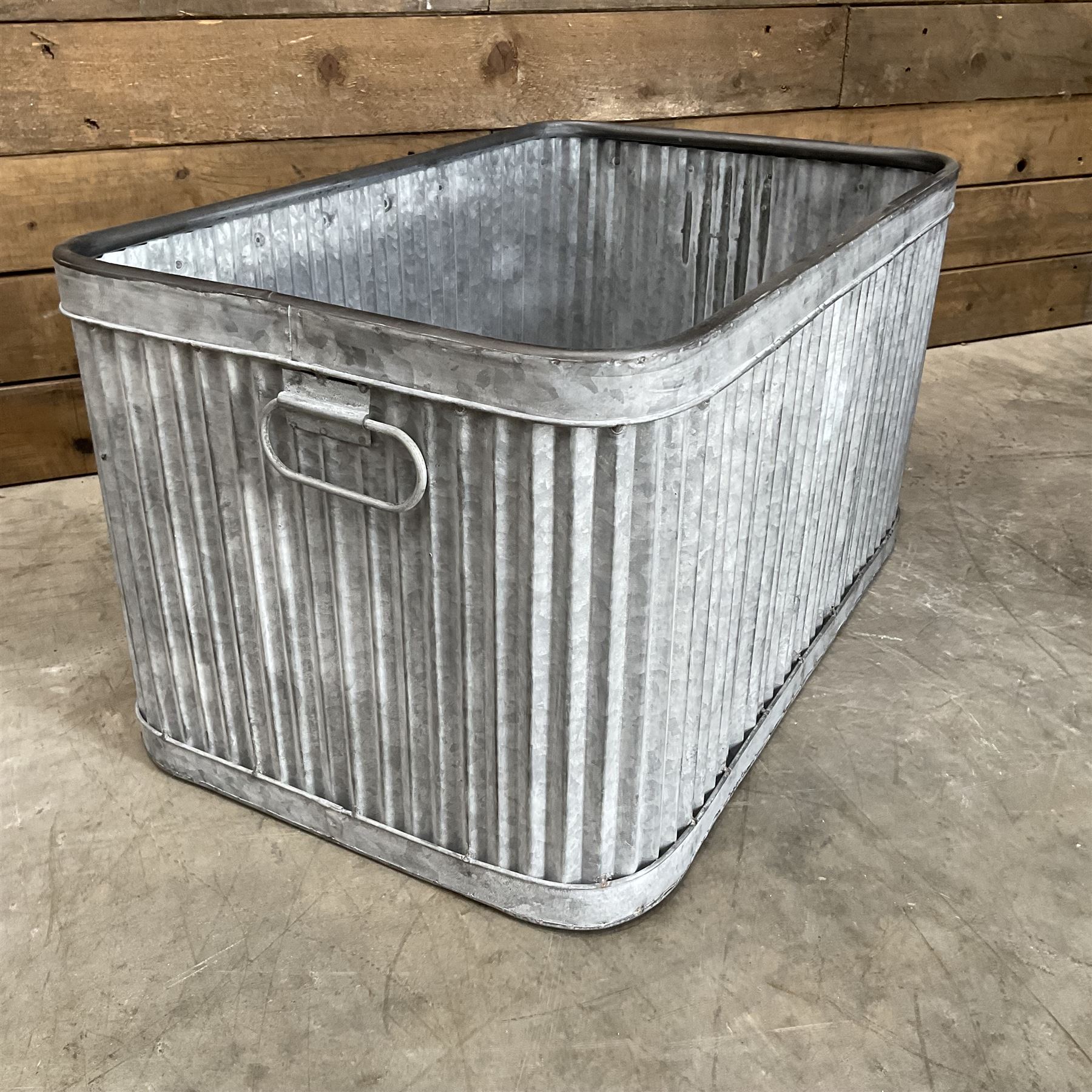 Set of three pressed metal planters in different sizes