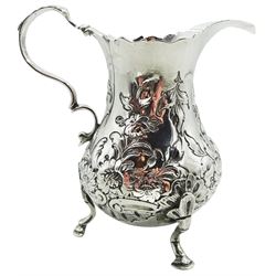 George III silver cream jug, of bellied form with acanthus capped scroll handle, the body with embossed foliate decoration, upon three hoof feet, hallmarked London, probably 1765, makers mark worn and indistinct, approximate weight 3.56 ozt (111 grams)