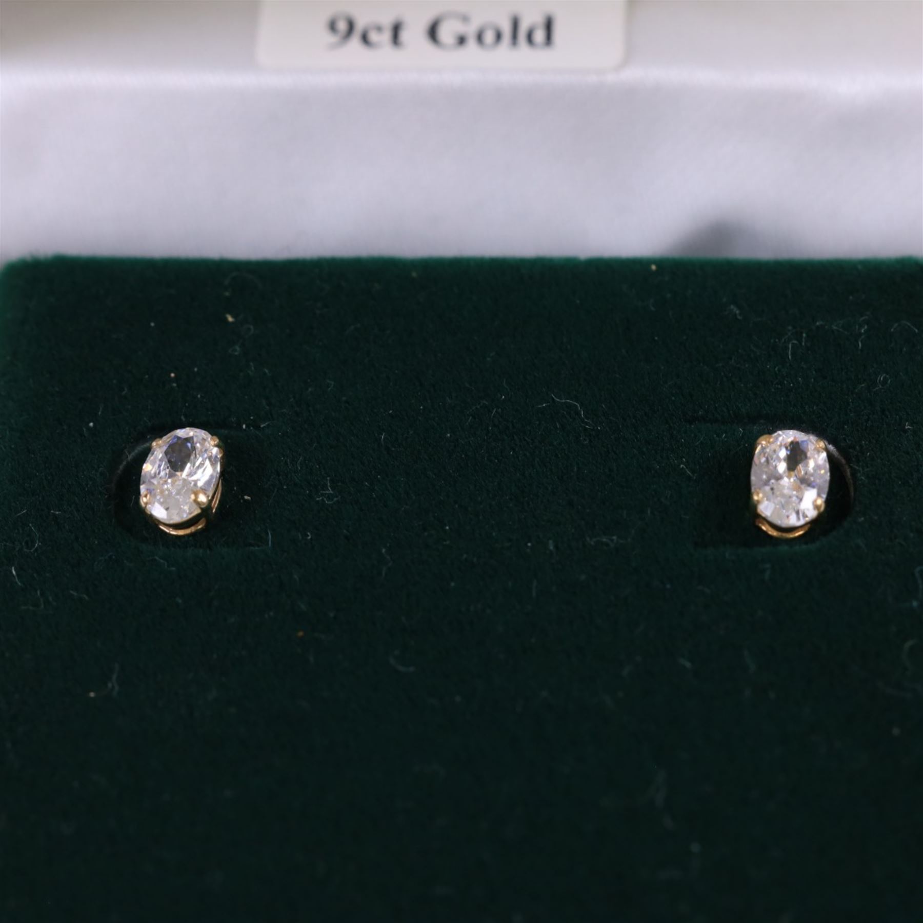 Pair of 9ct gold cubic zirconia stud earrings, boxed