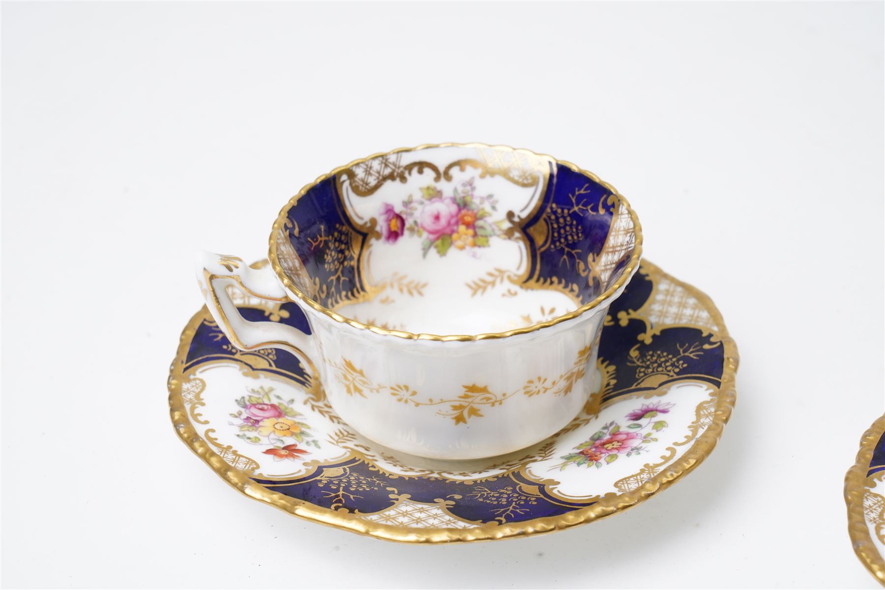 Grainger Lee & Co Worcester teacup, together with a collection of cobalt blue cabinet cups and saucers,  including a Royal Doulton hand-painted example by E Percy, and various others 19th century and later, mostly unmarked (7 pairs)