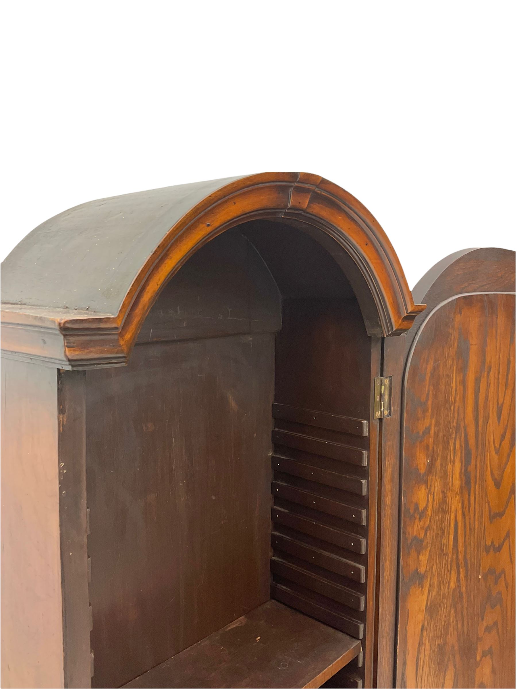 Small early 20th century Queen Anne style bookcase on bureau secretaire, the moulded arched pediment over mirrored door in shaped frame, the bureau fitted with fall front enclosing curved fitted interior, cushion moulded drawer over single drawer, on scroll and shell carved cabriole supports