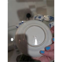 Pair of Chinese blue and white tea bowls, one with cover and four saucers, depicting two figures on a boat at sea, tea bowl H7cm