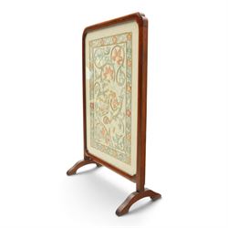 Victorian mahogany firescreen, rounded rectangular frame inset with embroidered panel depicting exotic birds amongst scrolling flowering foliage and butterflies, on out-splayed feet