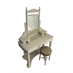 Edwardian cream painted dressing table, fitted with rectangular swing mirror over two trinket drawers with ceramic handles, rectangular top with frieze drawer, raised on turned front supports; with circular stool, leather seat over four turned supports