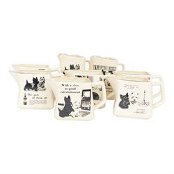 Eight Black and White Scotch Whisky advertising jugs