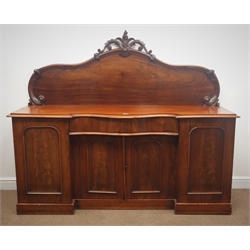  Victorian mahogany chiffonier, arched back with floral carved cresting, serpentine front central drawer, four cupboards, plinth base, W182cm, H153cm, D50cm  