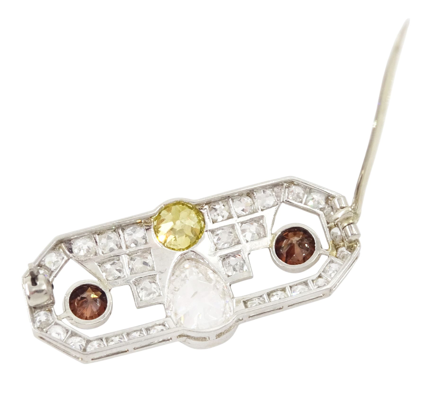 Early 20th century platinum diamond brooch, milgrain set with a pear cut faint brown diamond of approx 1.50 carat, an old cut fancy yellow / green diamond of approx 0.70 carat, and two old cut fancy orange / brown diamonds of approx 0.40 carat and 0.35 carat, surrounded by old cut white diamonds in an openwork setting, total white diamond weight approx 1.45 carat