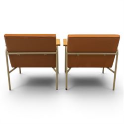 Pair of mid-20th century painted wrought metal easy armchairs with tan leather upholstery and teak armrests