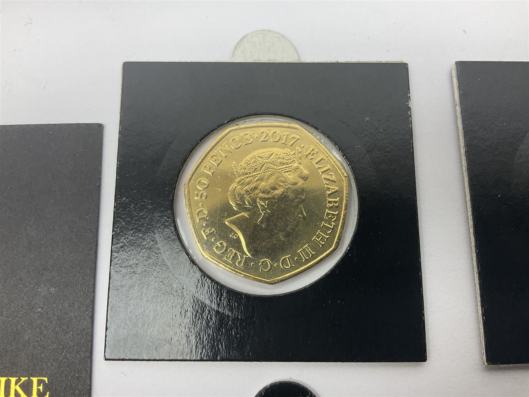 Four gold plated and coloured commemorative fifty pence coins, comprising 2017 Benjamin Bunny, Mr Jeremy Fisher, Tom Kitten and The Tale of Peter Rabbit, with Gold Strike certificate of authenticity