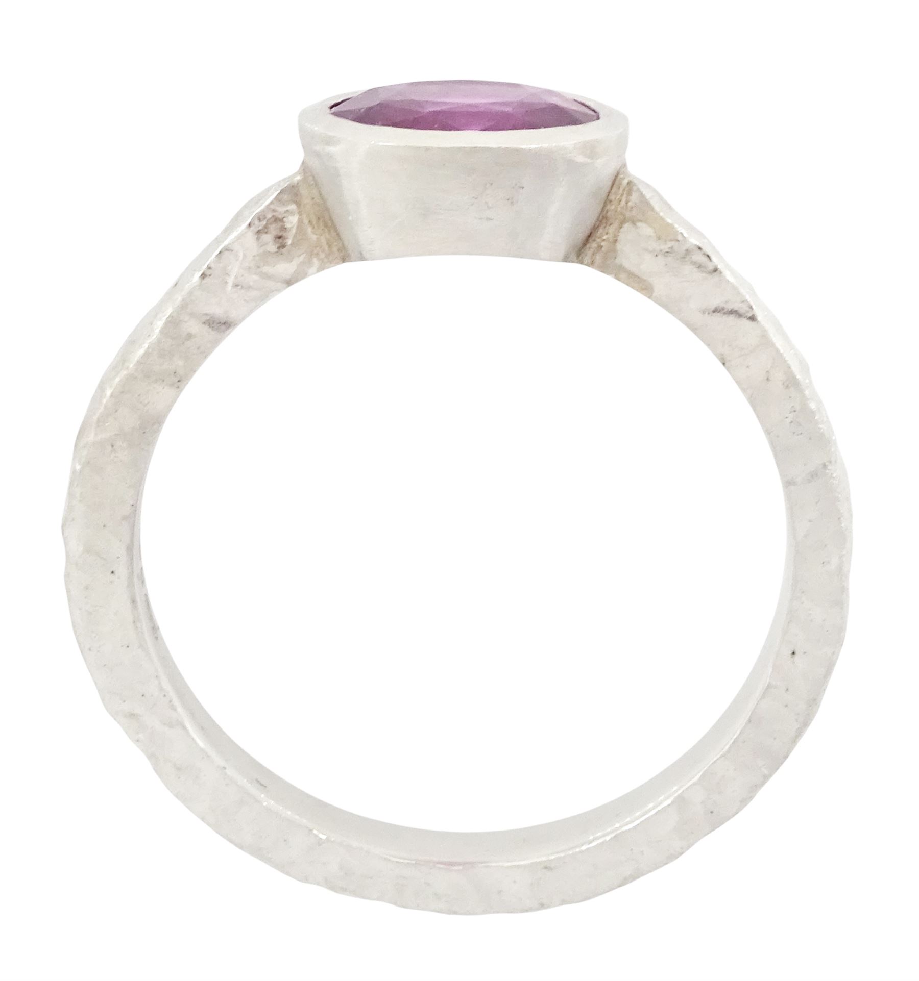 Platinum pink sapphire ring, single bezel set sapphire of approx 1.40 carat, to a planished shank, London 2019