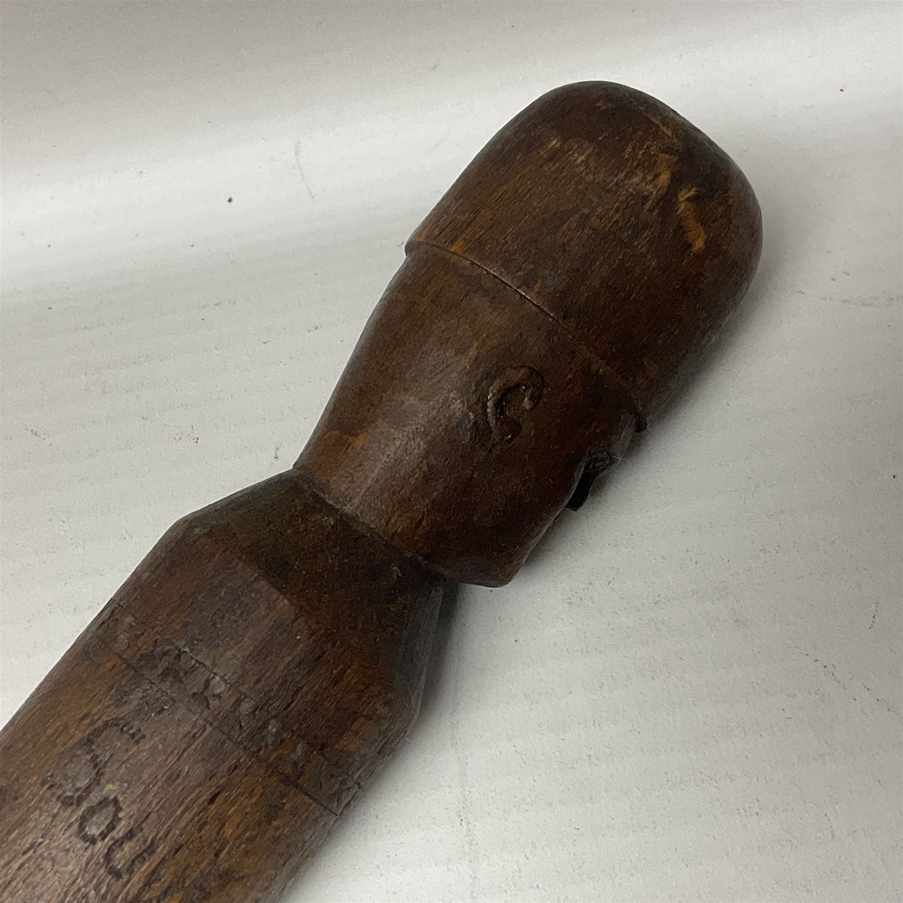 WW1 Prisoner of War carved beech walking cane, the terminal as a head wearing a helmet, and inscribed 'Souvenir from 370th PoW Coy Menin 1919'; bears metal plaque with indistinct monogram L91cm