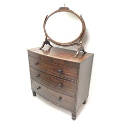 Early 19th century cross banded mahogany chest, three drawers, turned supports (W97cm, H93cm, D53cm) and oval mirror (2)