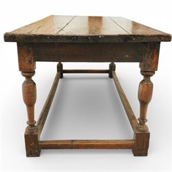 Late 17th to early 18th century oak joint refectory dining table, rectangular four plank top, raised on turned baluster legs, united by chamfered stretchers