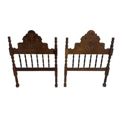 Pair Spanish stained beech single 3' bedsteads, spindle turned backs and carved with scrolling floral decoration 