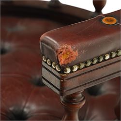 Georgian design captains swivel desk chair, rolled cresting rail over open spindle back on tripod base, upholstered in buttoned oxblood leather