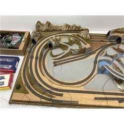 '00' gauge - table-top moulded plastic model railway layout with various rocky outcrops, tunnels, waterfall to lake, loops of Fleischmann track supplemented by Hornby track, bridges, kit built buildings and other accessories; together with Bachmann Class 150 2-car DMU Set and Hornby Northern Rail Class 142 2-car Set; both boxed; and small quantity of other rolling stock, three controllers etc  200 x 120cm