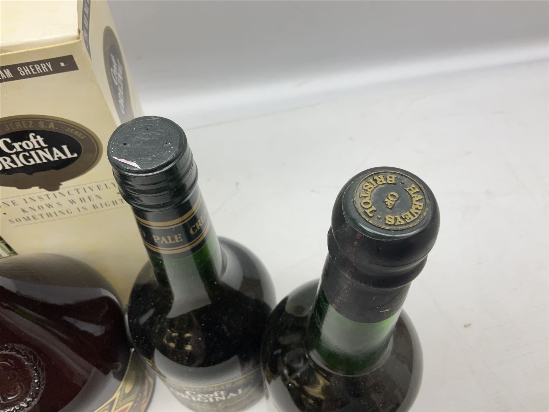 Mixed alcohol comprising Harveys Medium Dry Sherry, 70cl, one bottle, Croft Original Fine Old Pale Cream Sherry, 70cl, one bottle in box, Martini Extra Dry Vermouth, 90cl 18% vol, one bottle in box, Cockspur Barbados V.S.O.R Fine Rum, one bottle, and Baileys Irish Cream, 1l, one bottle (5)