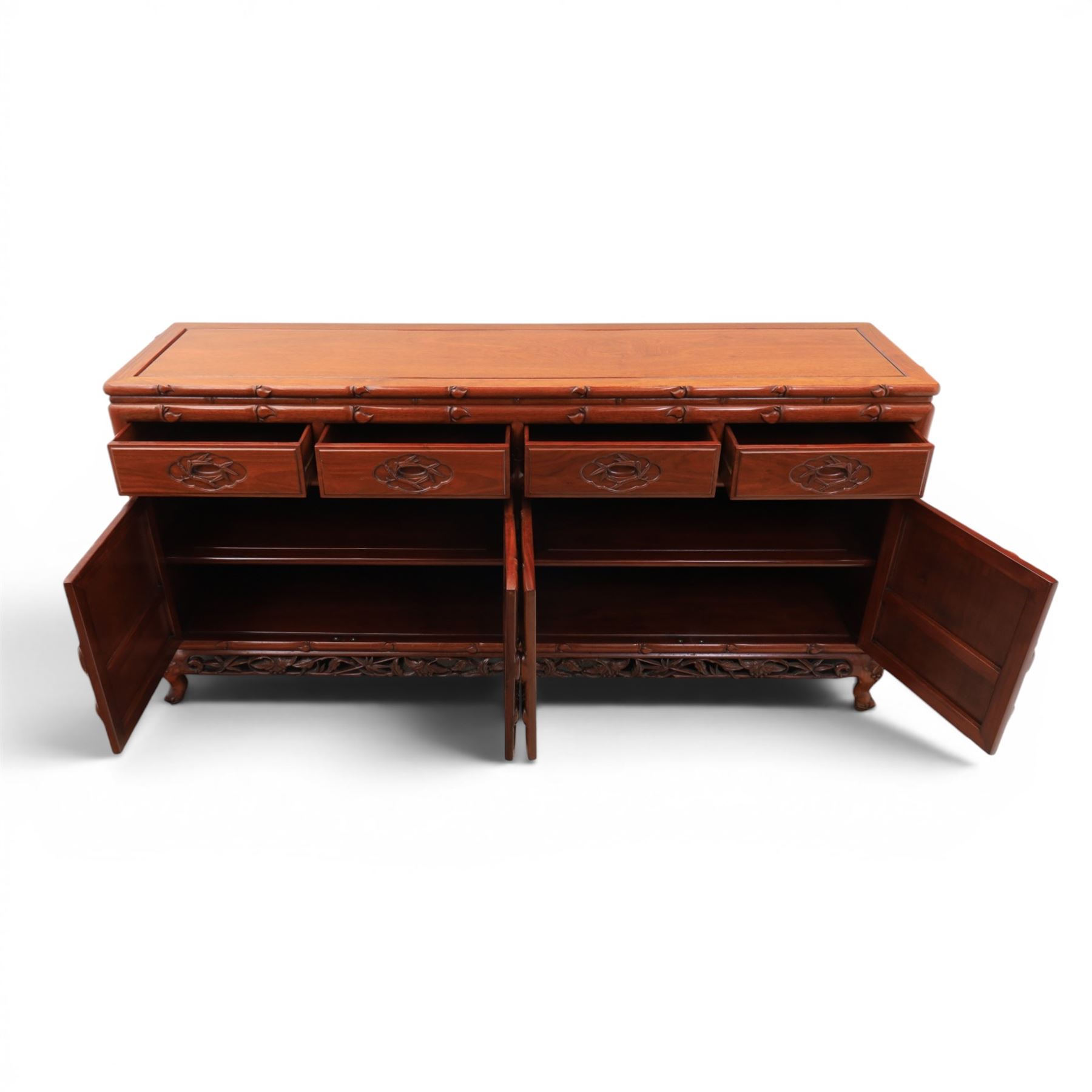 20th century Chinese ornately hardwood sideboard, rectangular top over four drawers above four cupboards, pierced carved apron, raised on cabriole legs 