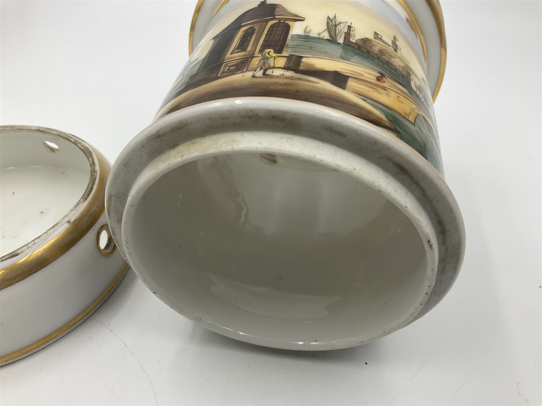 Two 19th century continental teapots and warmers, each teapot upon a cylindrical warming base, hand printed with seascapes, largest H22cm 