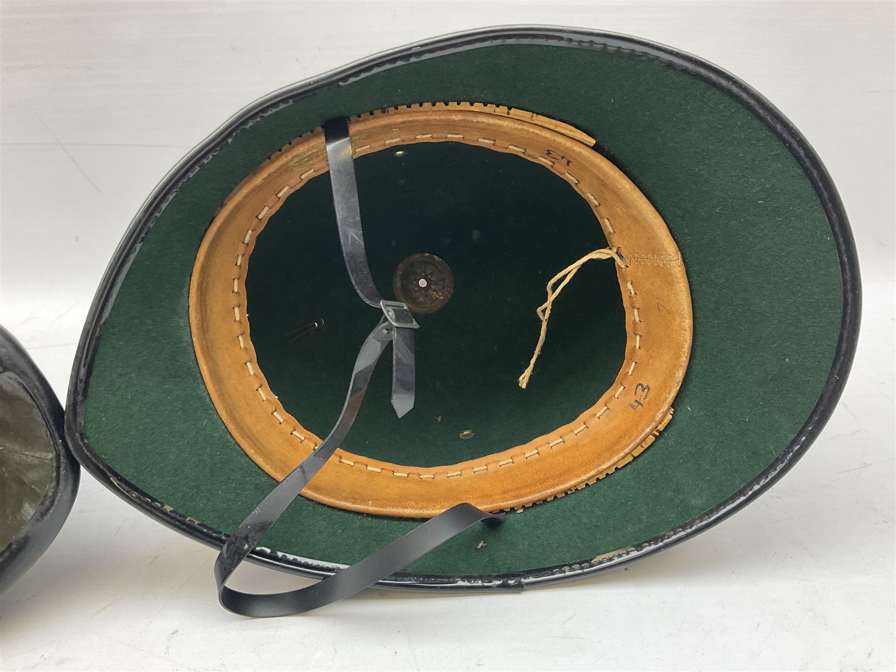 Hull City Police - helmet with king's crown night plate; two further ball-top helmets with Queen's crown plates; and a peaked cap (4)