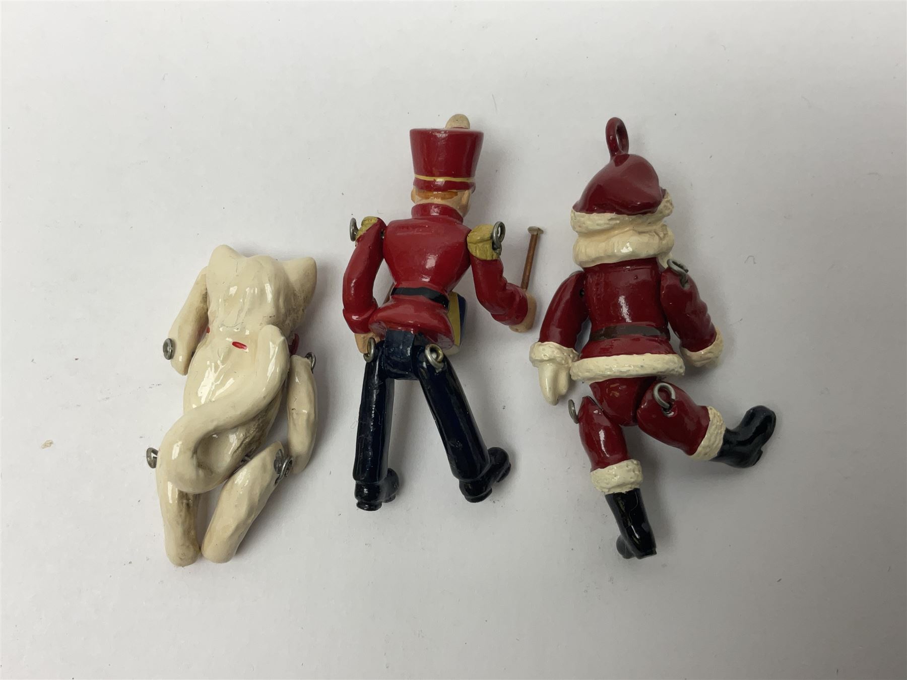 Six Hantel miniature articulated pewter figures, including Father Christmas, Drummer, pig etc 