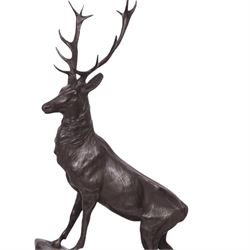 After Jules Moigniez (French 1835-1894): Pair of bronze stag figures on marble bases, each modelled alert standing on moulded rocky plinth on shaped marble bases, H74cm