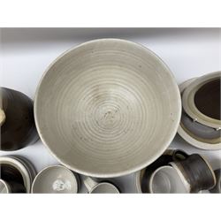 Marianne De Trey (British 1913-2016) stoneware coffee service for twelve, together with a large deep stoneware footed bowl and ladle with wood handle, all decorated in Manganese 'Pattern 1' with impressed shell marks, bowl D27cm