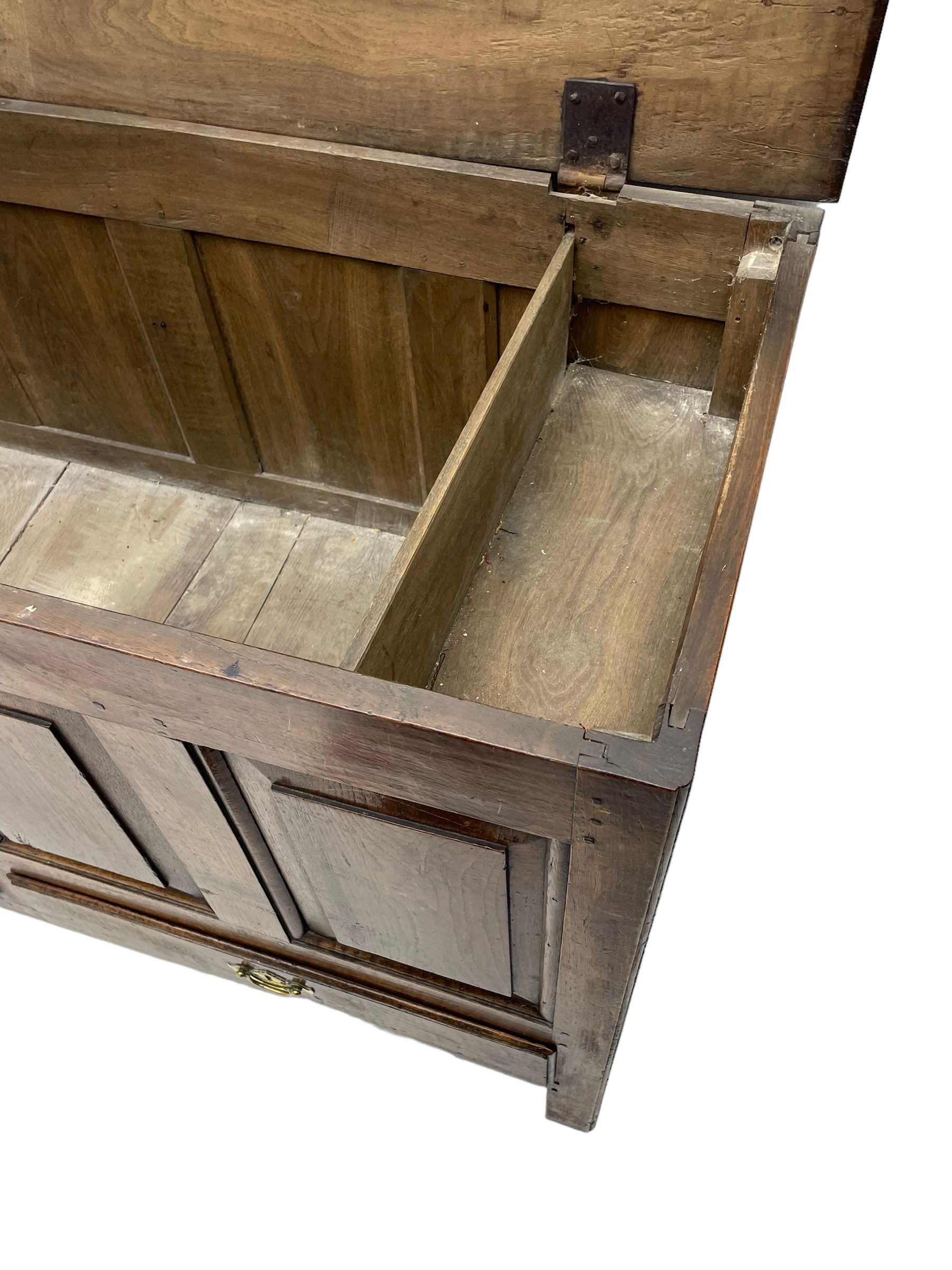 Georgian oak mule chest, moulded rectangular hinged lid over quadruple fielded panel front, the frieze inscribed '17 A Y 57', fitted with two drawers, panelled ends and back, on stile supports