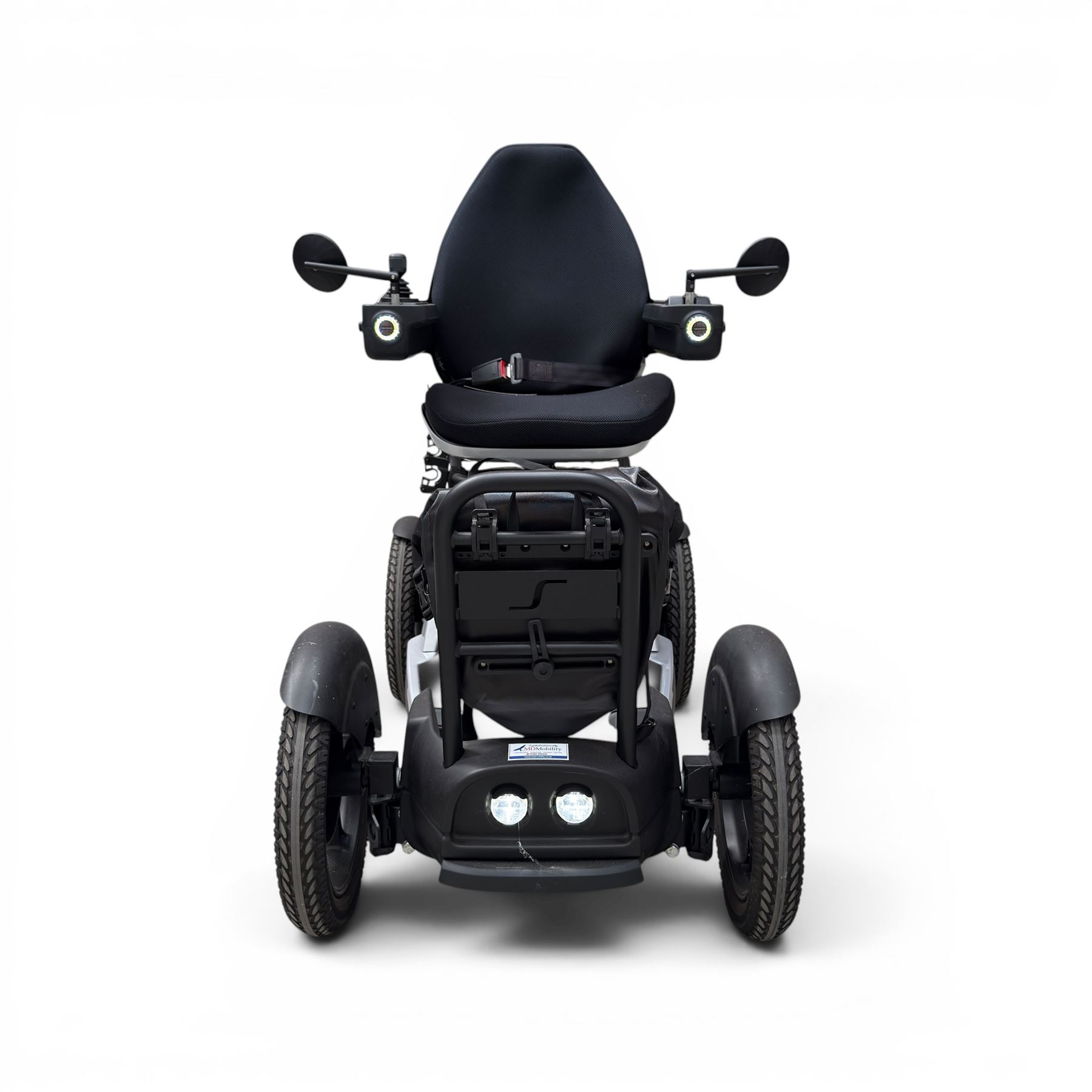 TGA Scoozy - mobility scooter, four wheel model with joystick controls, front storage bag, lights and grey and black bodywork.
