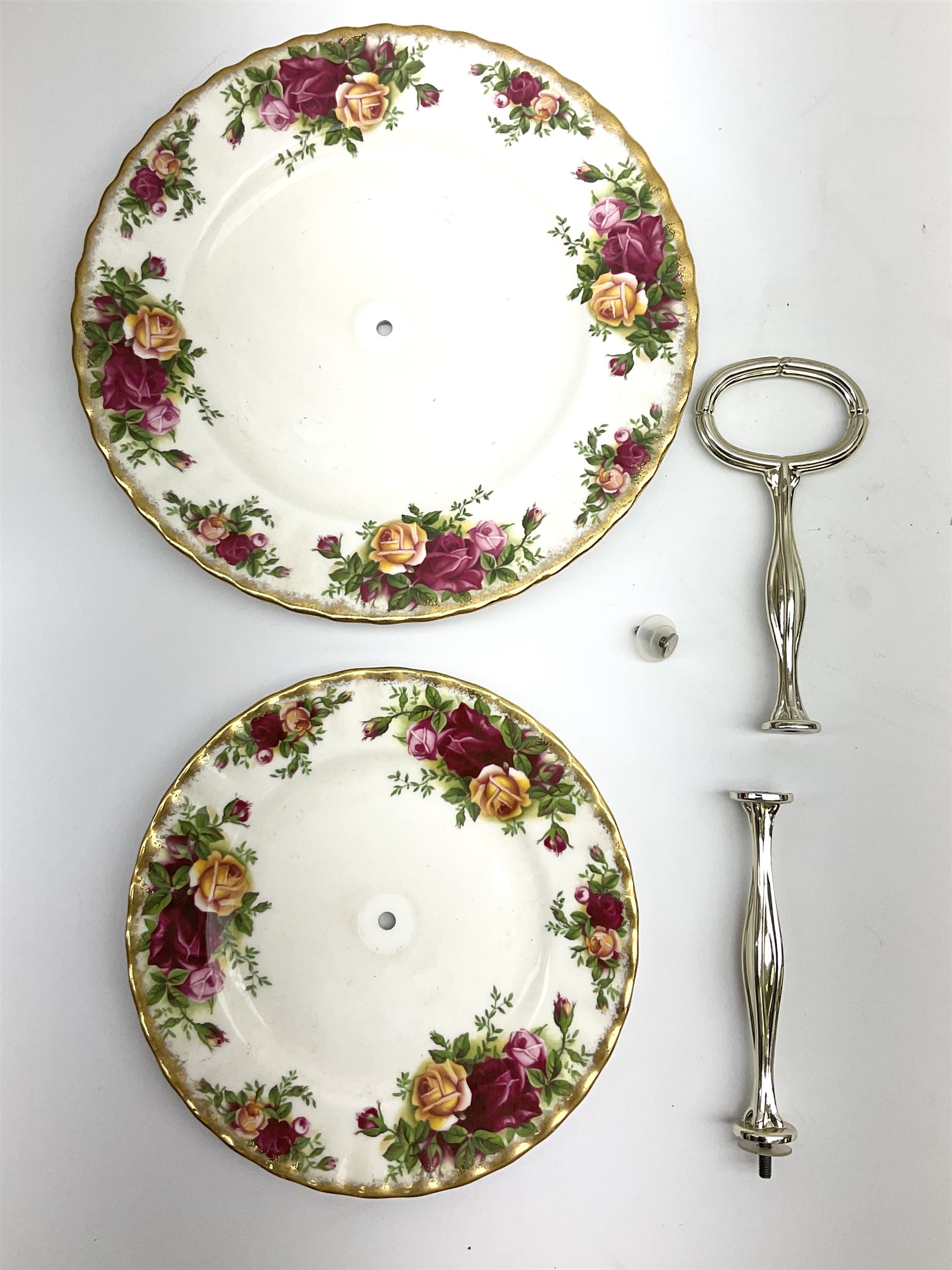 Royal Albert Old Country Roses part dinner and tea service comprising teapot, four tea cups and saucers, eight dessert plates, cake plate, cake stand, a tureen with cover, six dinner plates, an oval dish, two trinket dishes, bell and shoe decoration. 