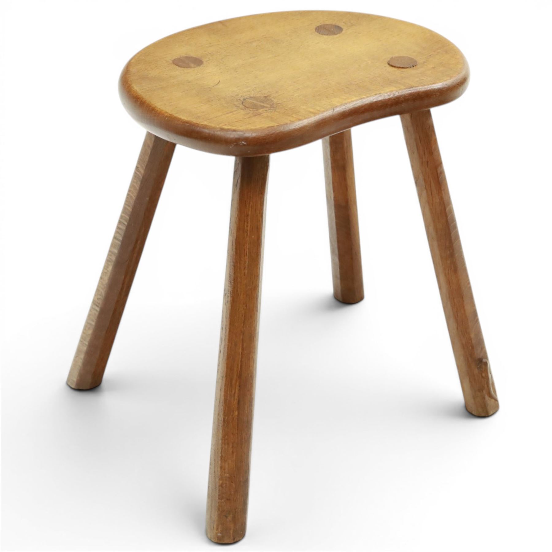 Lizardman - oak milking stool, shaped top with four octagonal supports with carved lizard signature by Derek Slater of Crayke