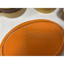 Le Creuset orange enamelled cast iron twin handled oval dish, together with other ceramic cookware 