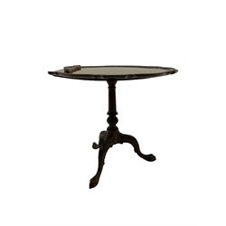 Chippendale design mahogany tilt top occasional table, with reeded column and leaf carved triple splay supports with ball and claw feet