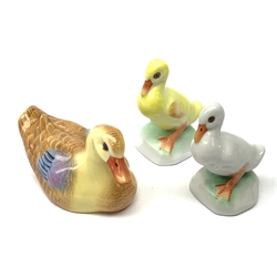 A Herend porcelain model of a Duck, together with two Herend Ducklings, each with printed mark beneath. 