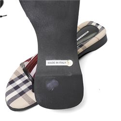 Christian Louboutin and Burberry - two pairs of designer shoes, comprising black leather Christian Louboutin low-top sneakers with black spike-studded toe caps and signature red soles, size 40, with dust bag, together with Burberry check canvas and red transparent strap sandals, size 39, with box and dust bag (2)