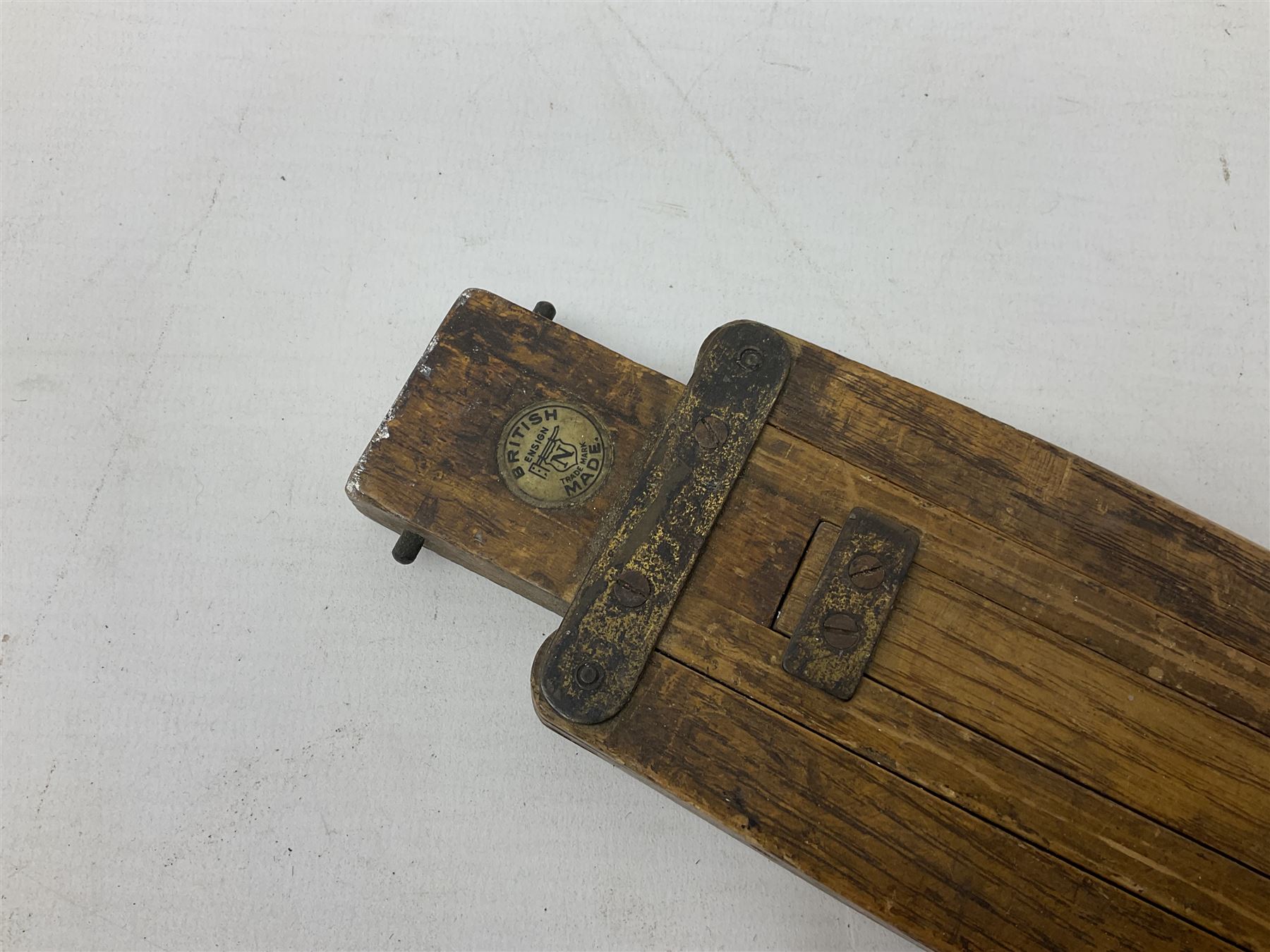Ensign 'The Sanderson' folding plate camera in mahogany and lacquered brass, field model with canvas wrapped box, two mahogany photographic plates, 'Busch rapid Symmetrical F:8' lens,  and a wooden tripod 
