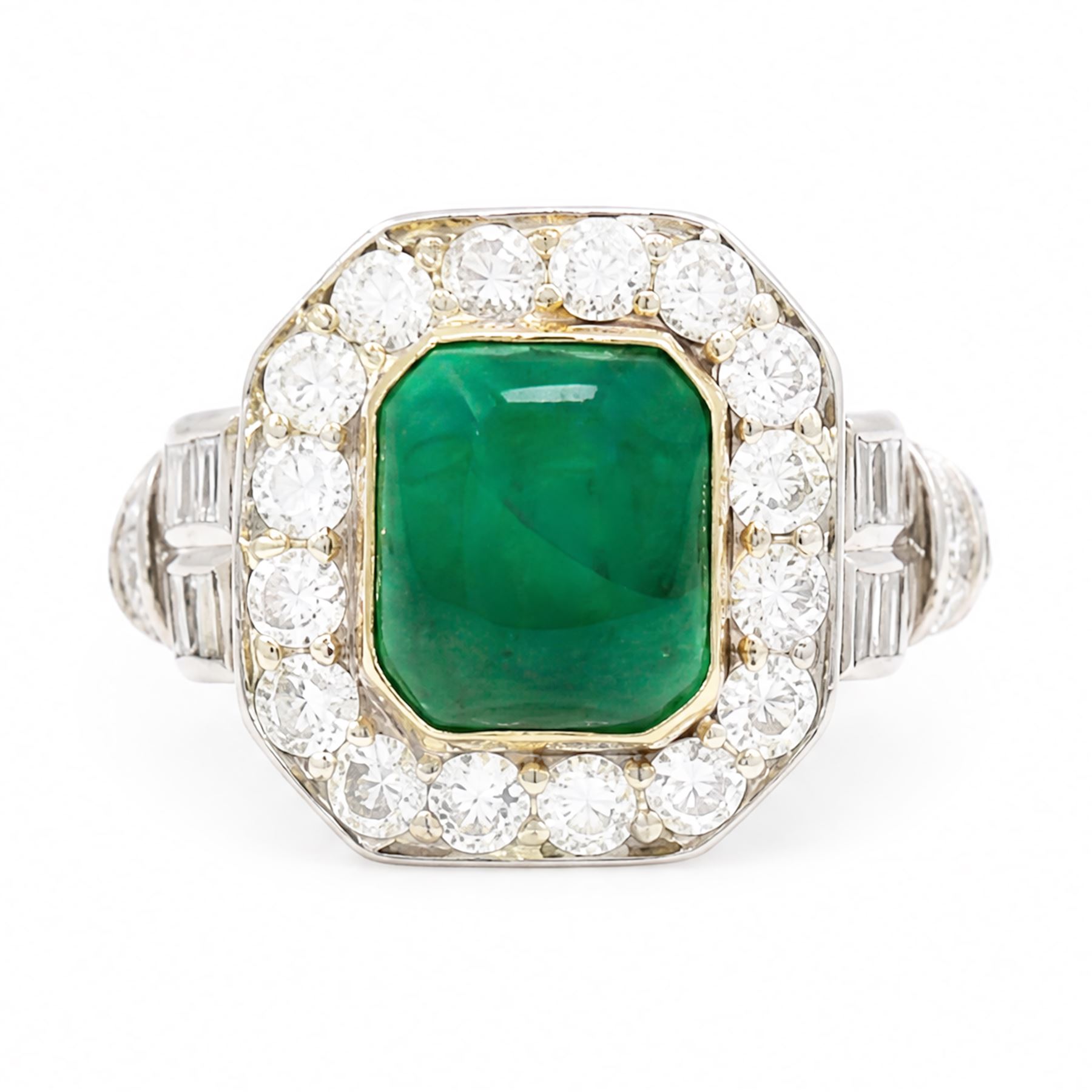 18ct white gold and platinum emerald and diamond cluster ring, single octagonal cabochon cut emerald, surrounded by sixteen milgrain set round cut diamonds, the shoulders set with baguette and single cut diamonds, stamped 18ct, total diamond weight approx 1.55 carat