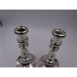 Pair of 1920s silver candlesticks, each upon knopped stem and weighted circular foot, hallmarked Birmingham 1926, maker's mark indistinct, H18cm